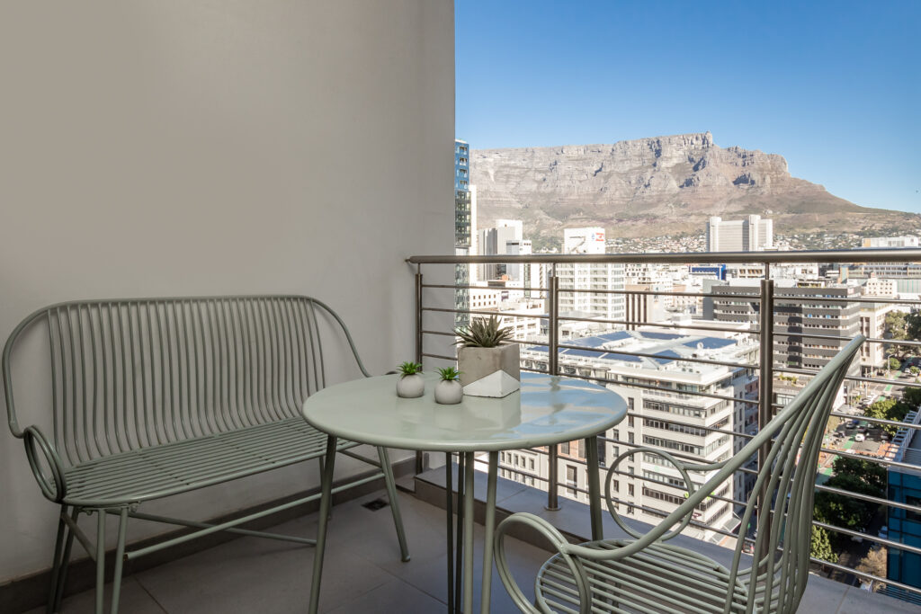 Luxury apartment balcony with Table Mountain views in Cape Town CBD.